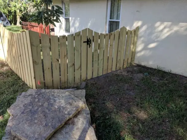 ustom Scallop Cut Wood Picket Fence installed by Gifford Fence