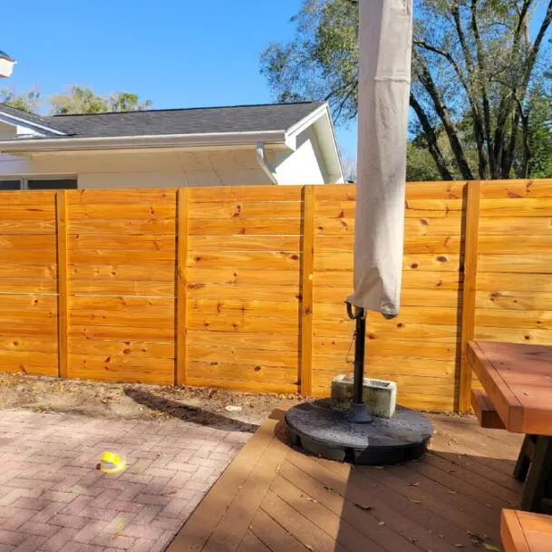 STANDARD HORIZONTAL BOARD FENCE STAINED NATURAL CEDAR