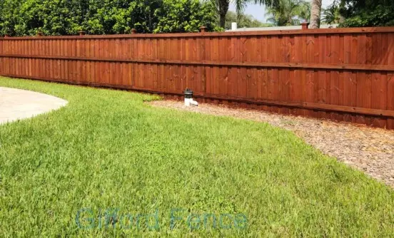Board on Board Cap Fence with Mahogany Stain
